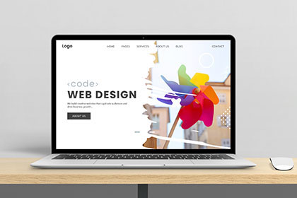 Professional business website design displayed on laptop.