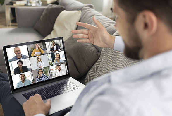 Business professional hosting online team meeting via video conference call.